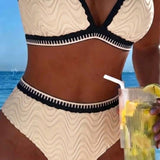 "Divkrāsu teksturēts bikini ar divām siksnām" can be rewritten as "Divkrāsu teksturēts bikini ar divām siksnām" (the title is already clear and descriptive). However, if you're looking for a more engaging option, you could try:

"Divkrāsu teksturēts bikin